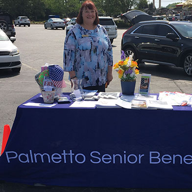 Sue Tompkins at Palmetto Senior Benefits table